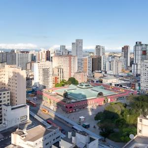 a view of a city with a large building at Apart 1803 - Centro Curitiba in Curitiba