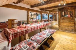 a room with a long table with pillows on it at Schwörerhof in Eisenbach
