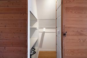a room with a closet with a wooden door at Haslehaus in Feldberg +61 photos