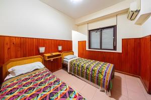 a hotel room with a bed and a window at "Alpha", downtown hotel room in Rosario