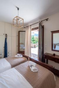 Postel nebo postele na pokoji v ubytování Penelope Villas
