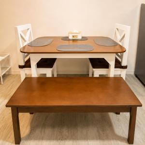 a wooden table with a bench next to it at Nuvali Studio Retreat Free Parking Fast WiFi Pool in Calamba +10 photos