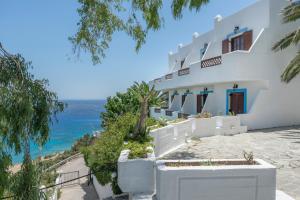 a white house with a view of the ocean at Hotel Albatros in Karpathos