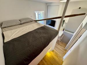 a bedroom with a large bed in a room at Peregrino Residence in Punat