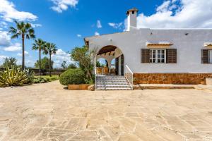 a white house with a stone driveway at Chalet Irene by dracmallorca in Santanyi