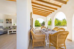a dining room with a table and chairs at Chalet Irene by dracmallorca in Santanyi