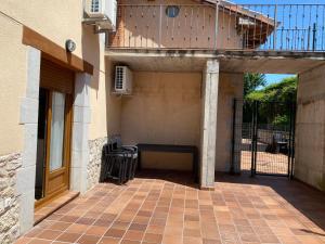 a patio with a bench in the back of a building at R2R - Apartamentos Prellezo - C20C03 in Prellezo