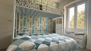 a bedroom with a bunk bed and a ladder at Villetta Fioregreco - free parking - Large outdoor space in Sanremo +65 photos