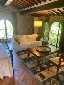 a living room with a couch and a coffee table at il MOLENDINO in Calci