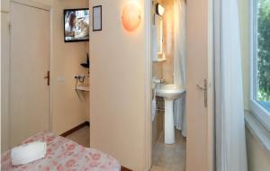 a small bathroom with a sink and a toilet at Storyville Simple Stay - Special Offers in Cinquale