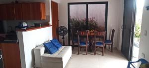 a living room with a table and a couch at Atardeceres in Puerto Rey