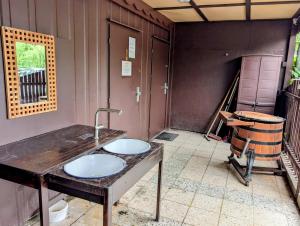 a bathroom with two sinks in a room at Radler-Pension in Lübbenau
