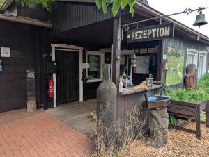 a restaurant with a bench in front of a building at Radler-Pension in Lübbenau