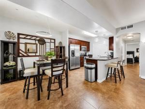 a kitchen and living room with a table and chairs at Southern #1083 Mesa in Mesa