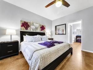 a bedroom with a large bed and a ceiling fan at Southern #1083 Mesa in Mesa +29 photos