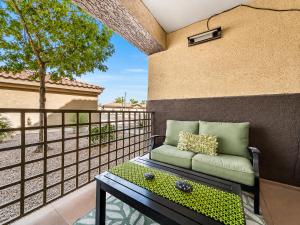 a couch sitting on a balcony with a fence at Southern #1083 Mesa in Mesa