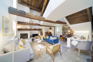 a living room with a couch and a table at Chez Castagné in Issor +62 photos