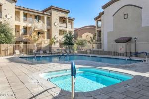 a swimming pool in front of a building at Southern #1083 Mesa in Mesa