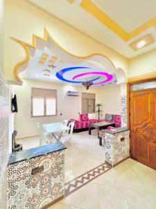 a living room with a table and a couch at Mhamid 4 in Marrakesh