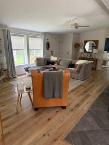 a living room with a couch and a table at The Roost by Simple Life Rentals in Baileys Harbor