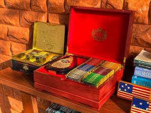 a red box sitting on top of books on a table at Tera Ella Boutique Hotel by SANS in Ella