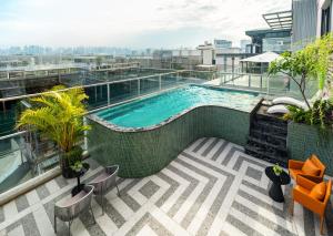 a swimming pool on the roof of a building at Minasi Grand Hotel in Hanoi