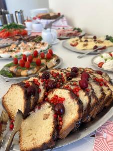 a table with many different types of food on it at Villa Marina in Dąbki