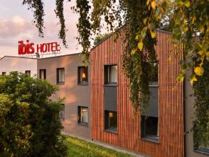 a building with a sign on the side of it at ibis Quimper in Quimper
