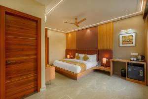 a bedroom with a bed and a wooden wall at The Roseville Grand Near Chandigarh University-Rayat Bahra University Kharar Chandigarh in Kharar +102 photos