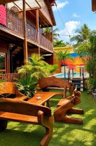 a group of benches sitting outside of a building at Hotelito Villas Holbox - Self Check In in Holbox Island