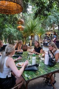 a group of women sitting around a table at Hotel & Hostel 7 in Florence +118 photos