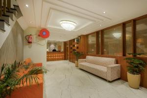 a lobby with a couch and potted plants at The Roseville Grand Near Chandigarh University-Rayat Bahra University Kharar Chandigarh in Kharar