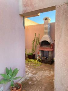 a view of a patio with an outdoor fireplace at Acquamarina Apartment with Terrace in Marsala