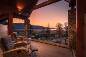 a view from the deck of a house with a large window at Lodore Falls Hotel & Spa in Keswick