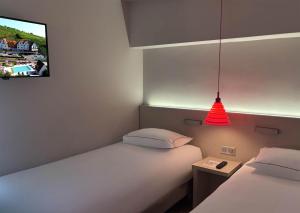 เตียงในห้องที่ Best Western Plus Hotel & SPA Le Schoenenbourg