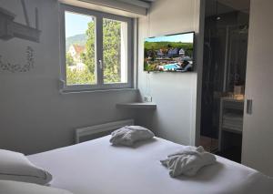 เตียงในห้องที่ Best Western Plus Hotel & SPA Le Schoenenbourg