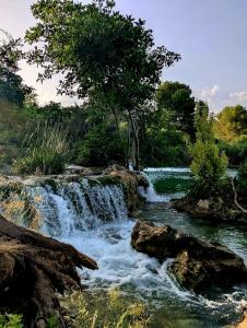 a waterfall in the middle of a river at Casa Ariño Ruidera in Ruidera