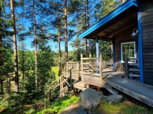 a porch of a cabin in the woods at Forest Lodge Ryokan in Trosa