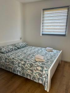 a bedroom with a bed and a window at Villa Jovičić in Prijedor +54 photos