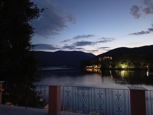 a view of a body of water at night at Setteacque Lakeview Rooms in Piediluco