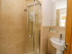 a bathroom with a shower and a sink at Craigard in Aberfeldy +26 photos