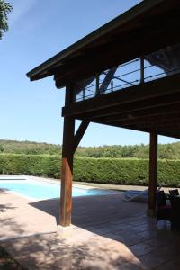 a pavilion with a view of a swimming pool at Bergerie - piscine privée in Cadrieu
