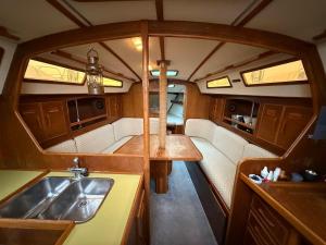 a view of a kitchen with a sink and a counter at Fully equipped sailing boat & exploring zodiac in Nyon