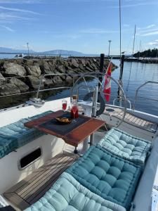 a table on the back of a boat at Fully equipped sailing boat & exploring zodiac in Nyon