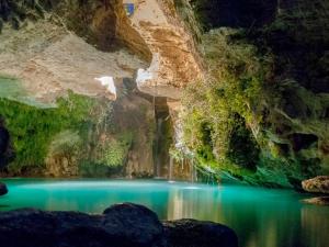 a pool of water in the middle of a canyon at La Casa Azul Bullas in Bullas