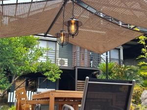 a patio with a table with a laptop on it at good wind 野風楼 in Yawatano +72 photos
