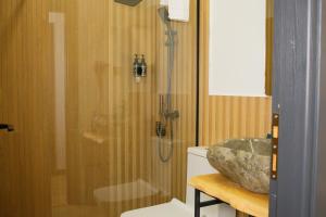 a bathroom with a shower and a sink at Lake side Dilijan in Dilijan +50 photos