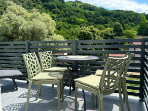 a table and chairs sitting on top of a balcony at Apartman Lami in Krapina