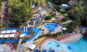an aerial view of a water park with a water slide at Los Flamboyanes Cozy Suite in Aguadilla