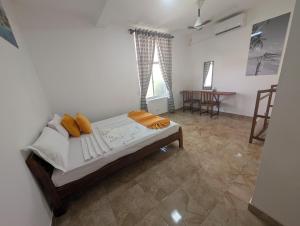 a bedroom with a bed in a room at AmeriLanka Transit Hotel in Seeduwa